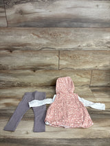 Toddler outfit with pink leopard print hooded vest, white long sleeve shirt, and gray leggings on wood background