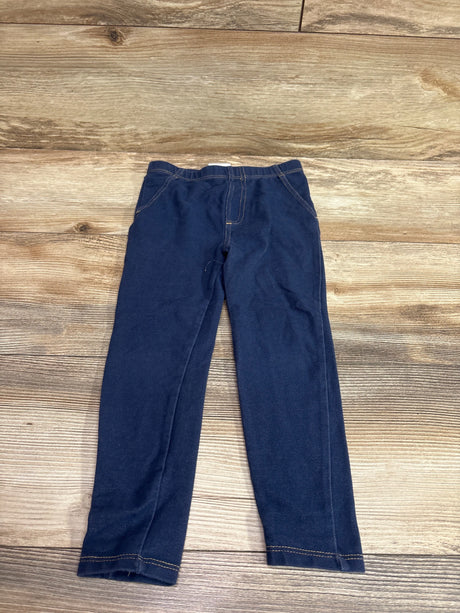 Front view of Koala Kids navy jeggings in size 4T showcasing an elastic waistband and contrast stitching on a wood-grain background