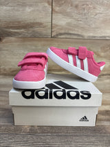 Pink Adidas toddler sneakers with velcro straps on box