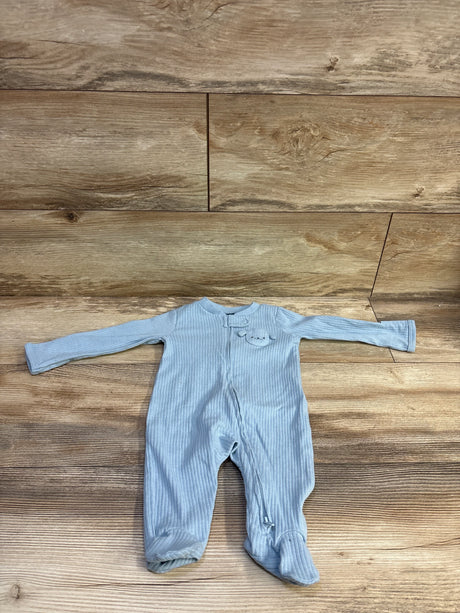 Front flat lay of light blue ribbed footed sleeper size 3M showcasing full-length sleeves and front zipper on wood floor background