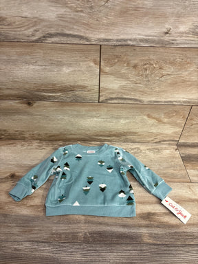 Blue long sleeve baby sweatshirt with geometric shapes pattern and Cat & Jack brand tag on wooden floor