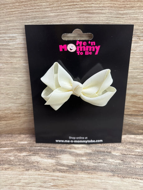 Front view of NEW Solid Hair Bow Ivory showcasing layered loops and center knot on a black display card