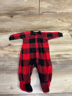 Red and black buffalo plaid fleece baby onesie with feet on wooden floor, kids clothes resale
