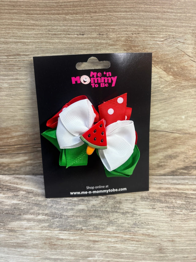 Front view of watermelon popsicle triple hair bow with red, white, and green ribbons and watermelon applique on black display card