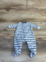 Flat-lay of Baby Gap newborn footed coverall showing light gray fabric with navy horizontal stripes and small elephant prints on wood floor background