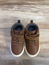 Top view of Carter's brown toddler sneakers, size 6C, showing faux-leather upper, velcro strap, and white rubber sole on wood floor