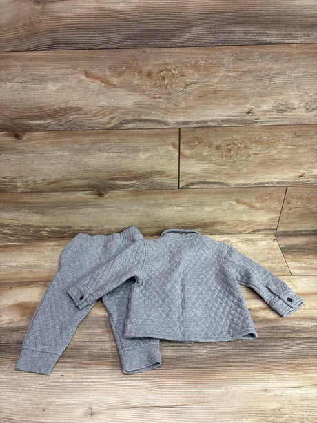 Old Navy 2-piece grey quilted button-up jacket and pants set for toddlers on a wood background