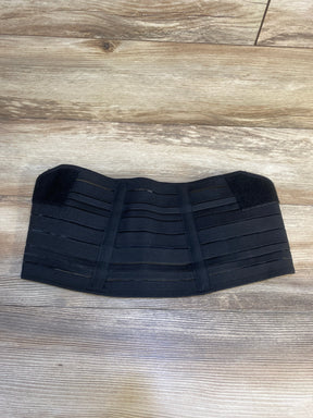 Black postpartum belly band waist support on wood floor, adjustable closure