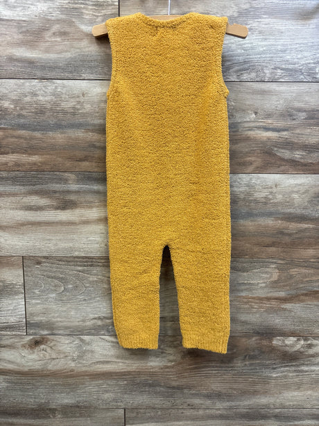 Amber yellow fuzzy sleeveless jumpsuit for babies by Me n Mommy To Be on a wooden background