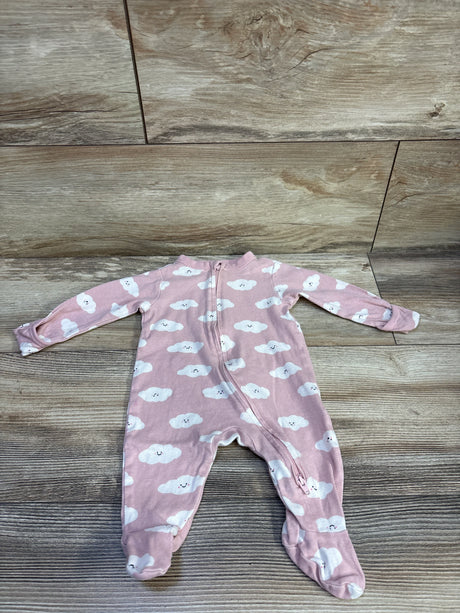 Top-down view of Old Navy pink cloud-print footed sleeper showcasing diagonal zipper and footed legs on light wood background