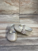 Front and side view of Mayoral Mary Jane shoe in tan showing scalloped trim and bow on strap on wood-look background