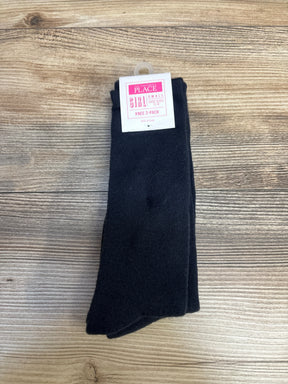 Children's Place girls small black knee socks 2-pack on wood background