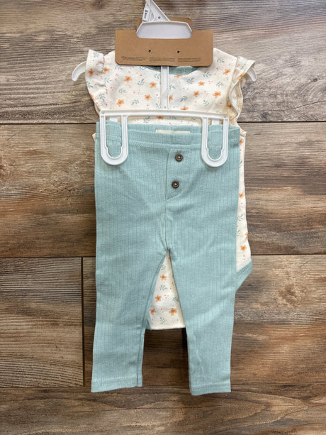 Front of 3-piece baby set, ivory floral bodysuit, mint ribbed pants with two buttons, matching headband on wood background