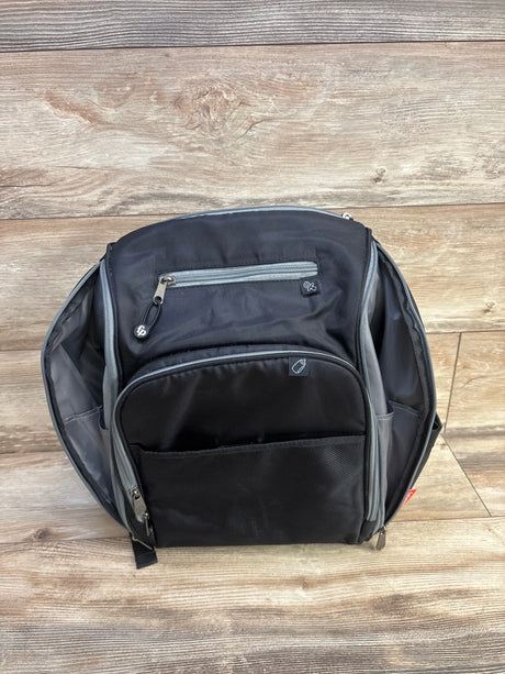 Front view of Fisher Price Kaden FastFinder diaper bag backpack in black with grey trim and multiple zip pockets on wood plank floor