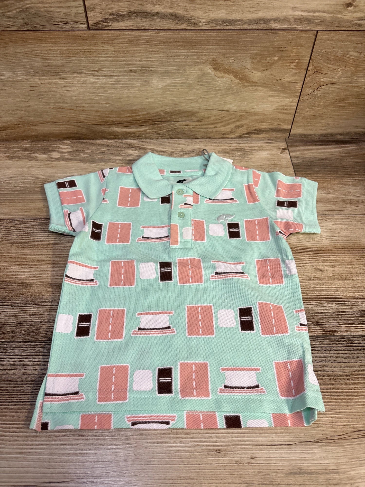 Front view of Monica + Andy Smores polo shirt in blue, size 3T, with collar, buttons, short sleeves, and geometric print
