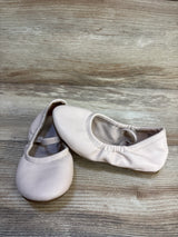 Light pink toddler ballet flats with elastic, gently used, on wood background