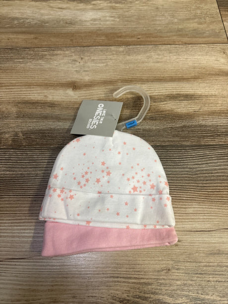 Front view of Gerber two pack caps showcasing white and pink caps with star pattern on a wood surface