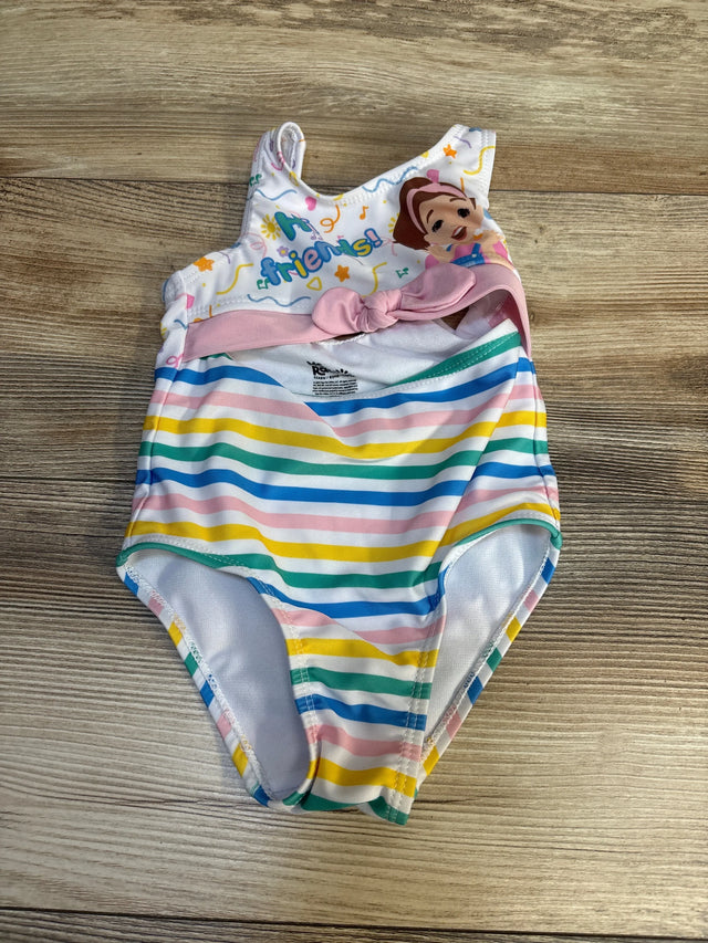 Colorful toddler one-piece swimsuit with rainbow stripes and cartoon character on wood floor