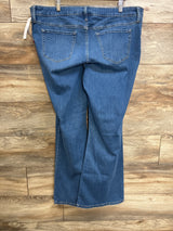 Back view of Isabel maternity flare jeans in blue, size XL, showcasing side-stretch panel and back pockets with wood floor background