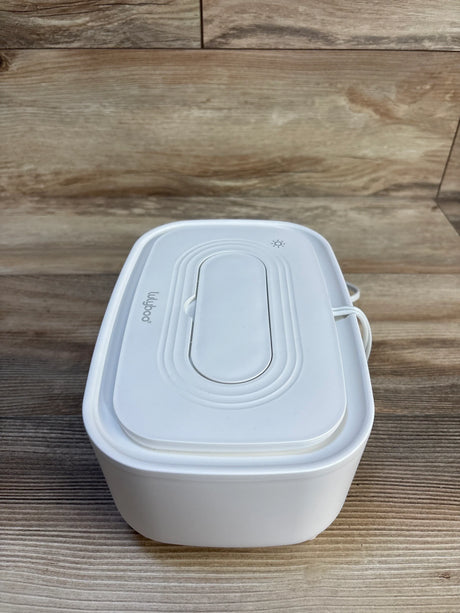White Lulujo baby wipe warmer with UV sterilizer on wood surface, ideal for infant care and nursery essentials