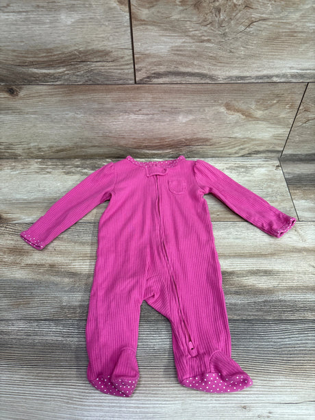 Front view of Carter’s pink ribbed sleeper, size 3m, with long sleeves, footed legs, and front zipper on wood look background