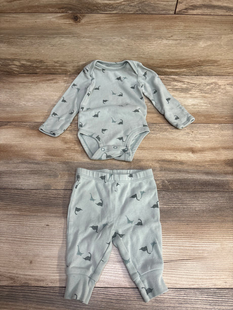 Gray baby long sleeve bodysuit and pants set with dinosaur print on wood background