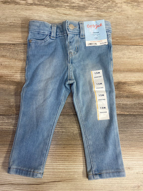 Light blue baby jeggings size 12 months with adjustable waist by Cat & Jack on wooden surface