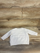 White knit toddler sweater with long sleeves on wood background, gently used kids clothing