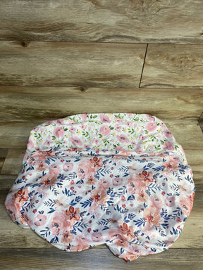 Floral baby blanket with pink and blue flowers on wooden floor