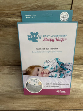 Baby Loves Sleep Sleepy Hugs swaddle sack packaging for older babies, on wood background