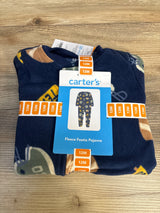 Folded Carter's fleece footie pajamas, 12 months, navy blue with sports pattern, on wood surface