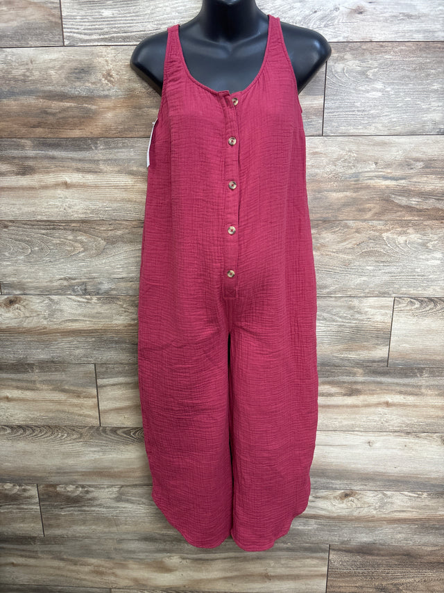 Front of burgundy Isabel maternity gauze jumpsuit on mannequin, button front, sleeveless, wide cropped legs, wood background