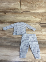 Flat lay of grey 2-piece kimono shirt and pants with elastic waist, navy little one print on light wood background