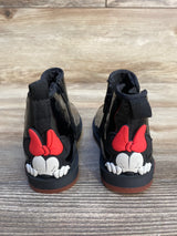 Black kids boots with red bow cartoon mouse detail on wooden floor