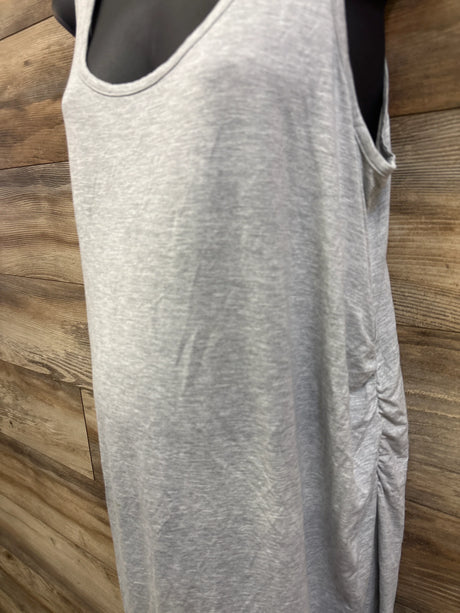Close-up front view of grey maternity ruched tank dress showcasing side ruching on a mannequin against wood plank background