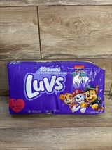 Front view of Luvs size 1 48-count diaper pack showcasing Paw Patrol character graphics on purple packaging against a wooden surface