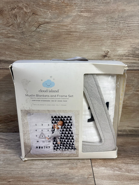 Front view of Cloud Island muslin blanket and felt frame set showing white blanket and gray felt frame in original box on wood surface