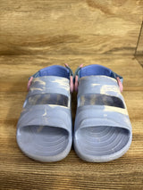 Front view of Rugged Shark Nature toddler sandals, size 10C, light blue marbled with pink heel buckles on wooden surface