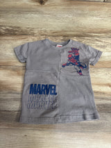 Gray kids Marvel t-shirt featuring Spider-Man graphic and repeated Marvel logo on wooden background