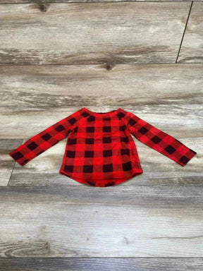 Front flat lay of Cat and Jack red and black buffalo check toddler long sleeve shirt, rounded high low hem on wood floor