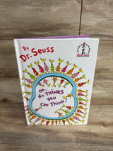 Dr. Seuss children's book Oh, the Thinks You Can Think! on wood surface, featured in kids resale store