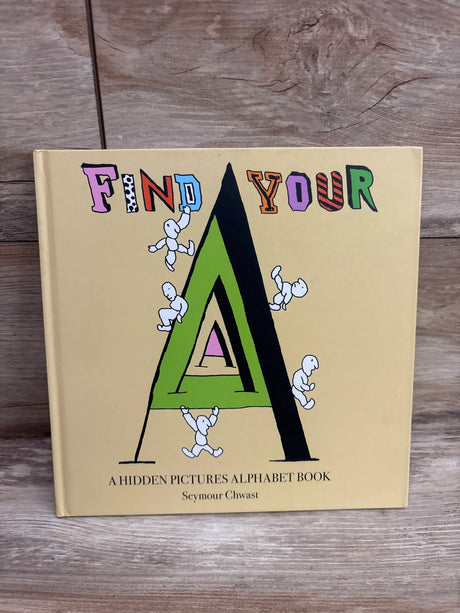 Front view of Find Your A alphabet search hardcover book showing colorful letter A and hidden figures on a wood grain background