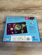 100 piece glow in the dark solar system puzzle box with planets, astronaut, and galaxy illustration
