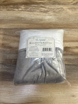 Top-down view of TL Care reversible chenille crib rail covers 2-pack showcasing gray and white fabric in clear packaging on wooden background