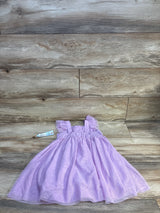 Light purple toddler dress with ruffle sleeves on wood background, kids clothing resale