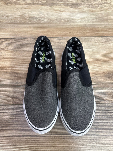 Top view of Cat & Jack gray canvas slip-on sneakers, size 13C, with pineapple-print lining and white soles on wood grain