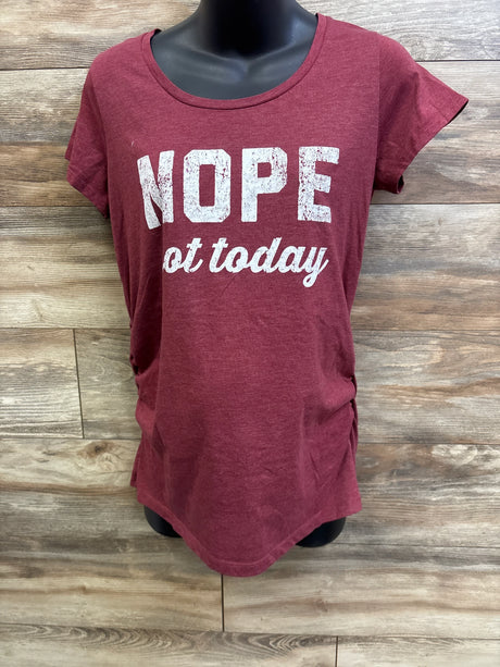 Front view of Bloom Maternity red tee showcasing white distressed NOPE not today print and side ruching on a black mannequin against wood background