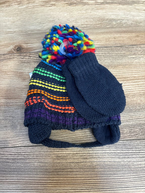 Knit kids winter hat with rainbow pom pom and dark knit mittens on wood background