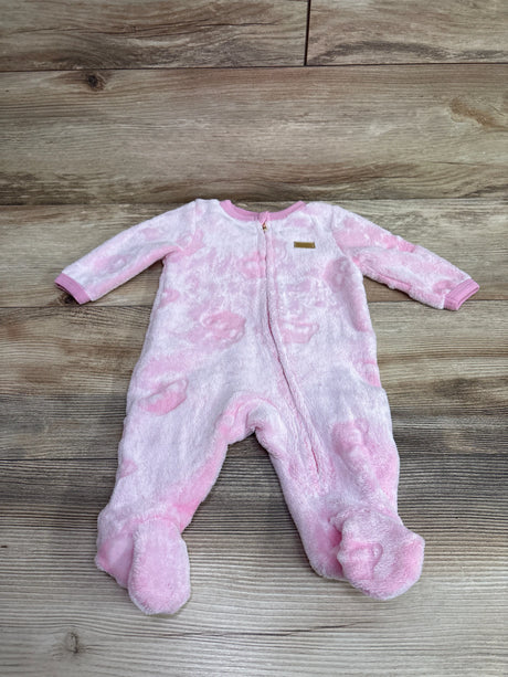 Front view of a pink Juicy Couture plush sleeper, size 0 to 3 months, with full-length zipper and covered feet on wood grain