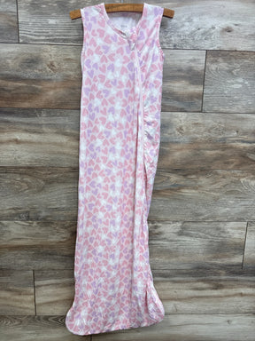 Pink and white sleeveless baby sleep sack with heart print, zip front, hanging on wood